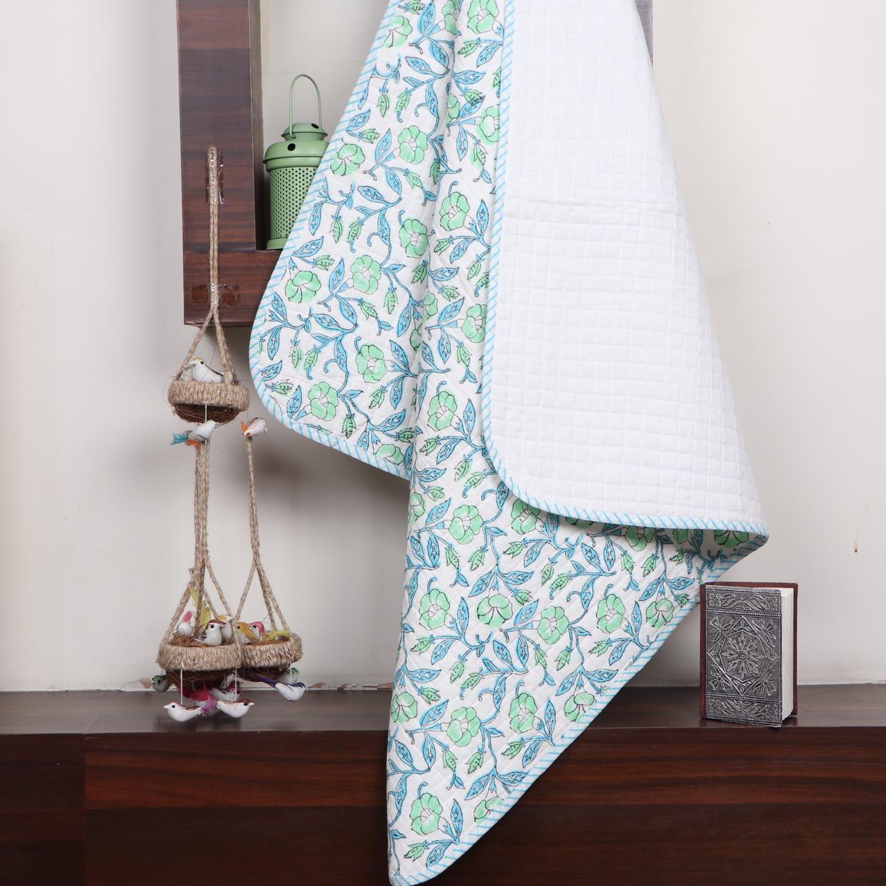 Baby quilt in Maya - Yuniku London