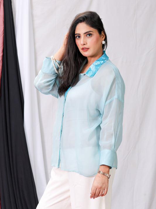 Model wearing elegant sea blue organza sequins shirt styled for spring-summer 2025 outfit