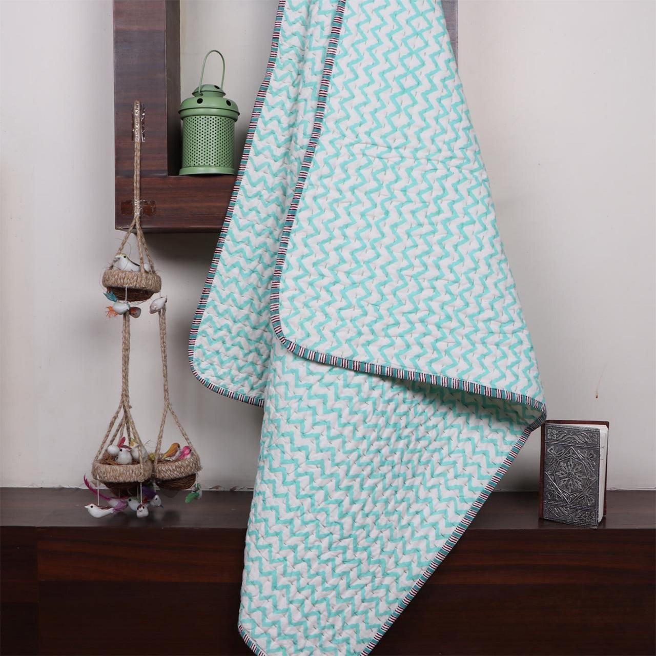 Baby quilt in Beryl - Yuniku London